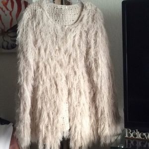 A fuzzy shaggy sweater/fall outerwear.